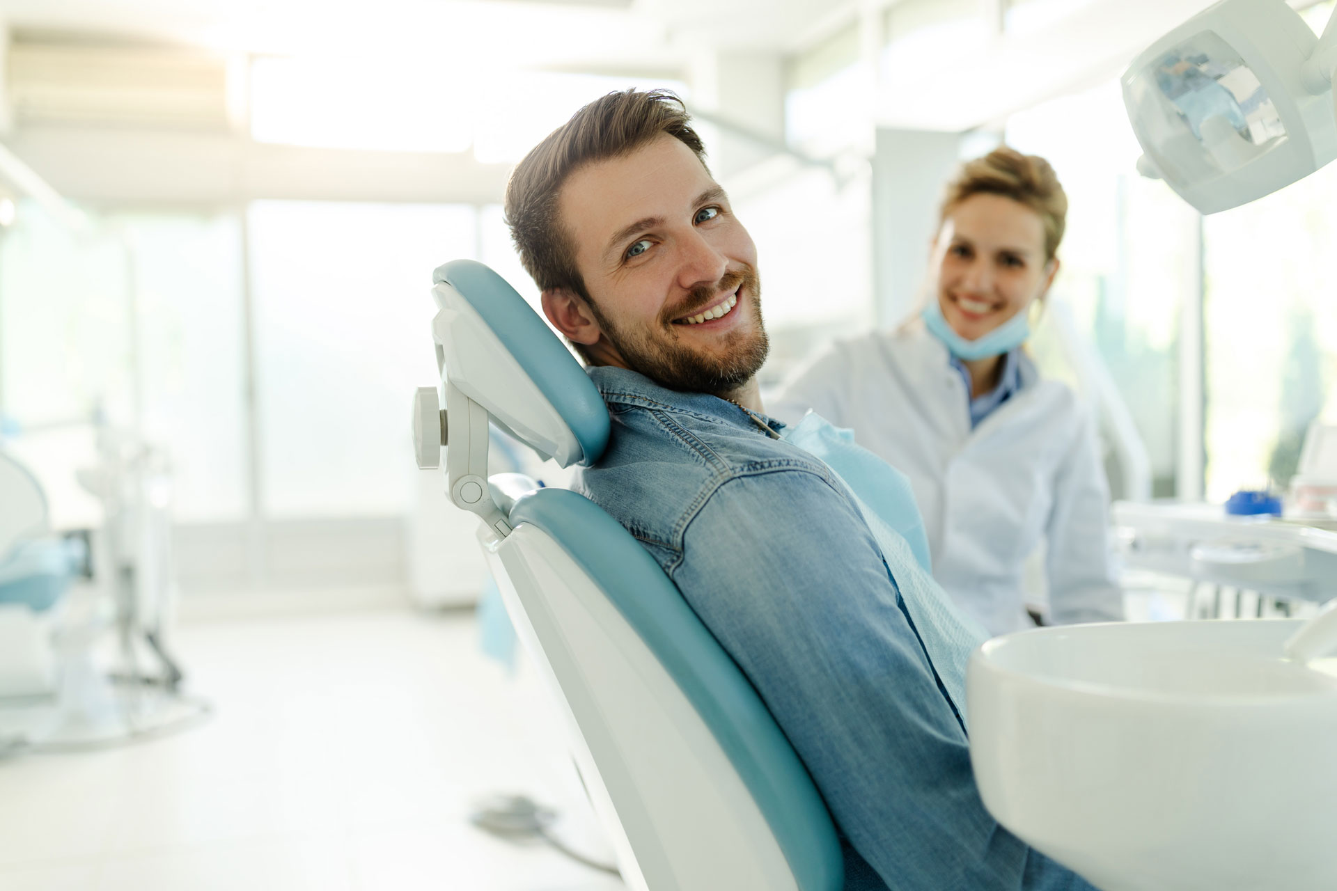 Patient in dentist chair with the dentist
