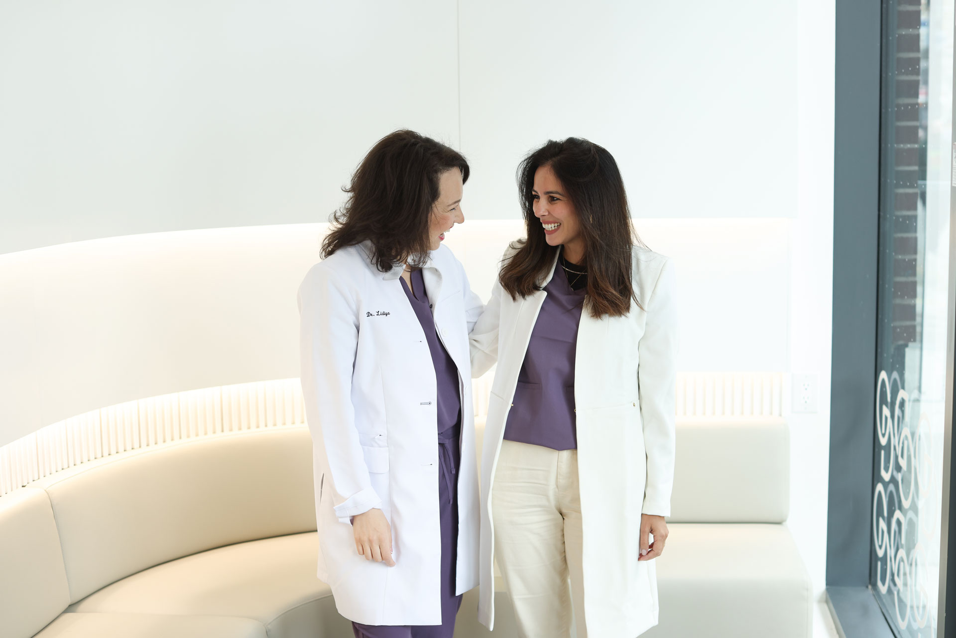 Gleam Dental, two women dentists in white coats indoors